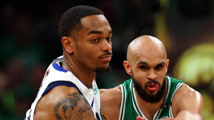 Jun 17, 2024; Boston, Massachusetts, USA; Boston Celtics guard Derrick White (9) knocks the ball away from Dallas Mavericks forward P.J. Washington (25) in game five of the 2024 NBA Finals at TD Garden. Mandatory Credit: Peter Casey-USA TODAY Sports