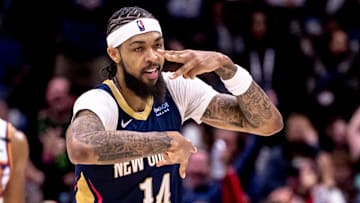 Dec 5, 2024; New Orleans, Louisiana, USA;  New Orleans Pelicans forward Brandon Ingram (14) reacts to making a three point basket against the Phoenix Suns during the first half  at Smoothie King Center. Mandatory Credit: Stephen Lew-Imagn Images