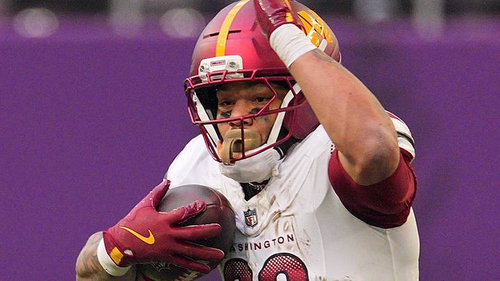 Dec 7, 2025; Minneapolis, Minnesota, USA; Washington Commanders running back Chris Rodriguez Jr. (36) rushes the ball against the Minnesota Vikings during the second half at U.S. Bank Stadium. Mandatory Credit: Brad Rempel-Imagn Images