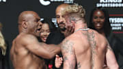 Nov 14, 2024; Irving, TX, USA;  Mike Tyson slaps Jake Paul after weighing in at the Toyota Music Factory.  Mandatory Credit: Kevin Jairaj-Imagn Images