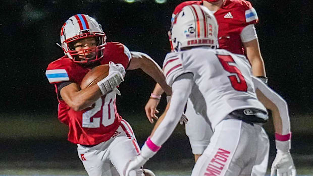 Wisconsin high school football: Jacob Siner sprints out of the backfield during a WIAA Division 1 playoff game last season.