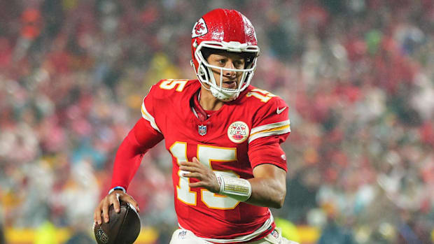 Patrick Mahomes rolls out to pass