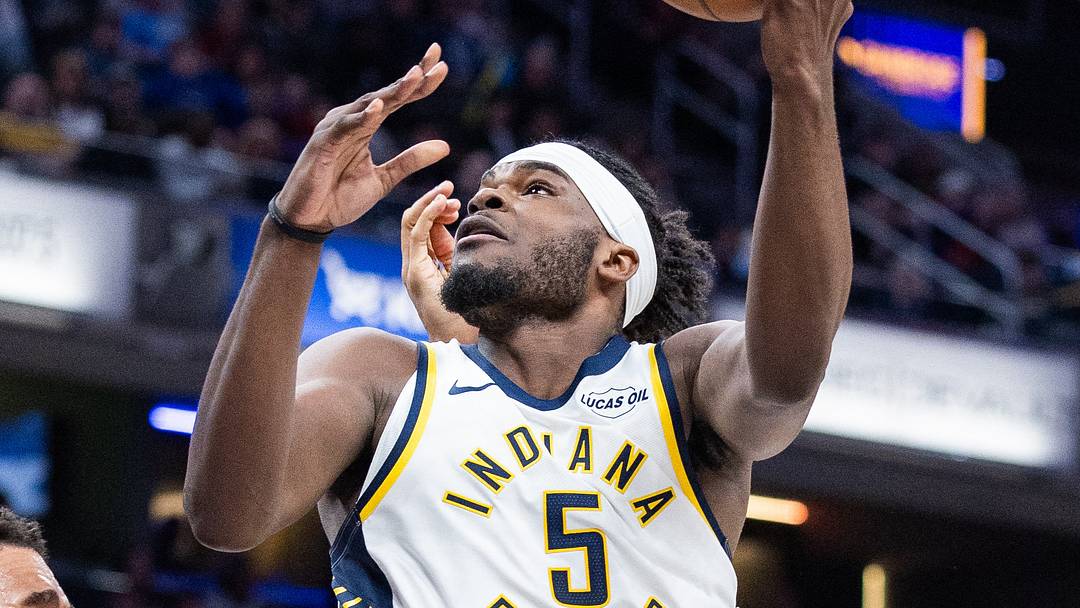 Mar 12, 2026; Indianapolis, Indiana, USA;  Indiana Pacers forward Jarace Walker (5) shoots the ball while Phoenix Suns forward Oso Ighodaro (11) defends in the first half at Gainbridge Fieldhouse. Mandatory Credit: Trevor Ruszkowski-Imagn Images