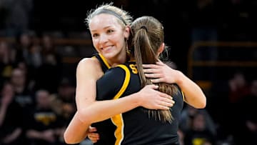 Iowa guard Taylor Stremlow (1) hugs Iowa guard Kylie Feuerbach (4) Feuerbach is subbed out of the game against Wisconsin on senior day Sunday, March 2, 2025 at Carver-Hawkeye Arena in Iowa City, Iowa.