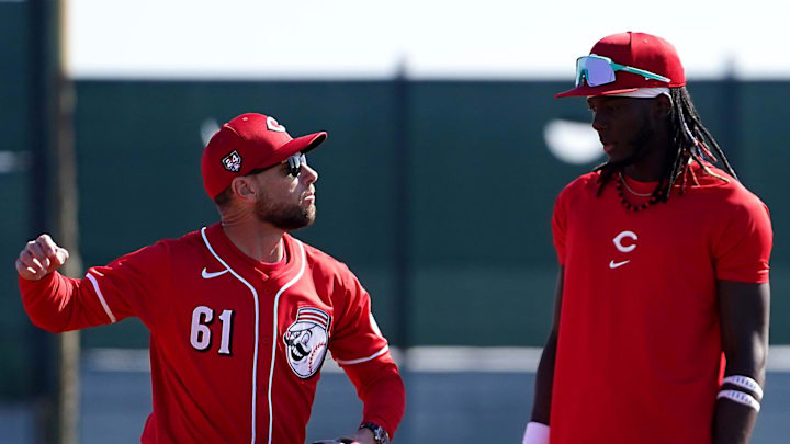 Cincinnati Reds bench coach Jeff Pickler instructs Cincinnati Reds third baseman Elly De La Cruz (44) at shortstop during spring training workouts, Wednesday, Feb. 14, 2024, at the team s spring training facility in Goodyear, Ariz. Cincinnati Reds bench coach Jeff Pickler instructs Cincinnati Reds third baseman Elly De La Cruz (44) at shortstop during spring training workouts, Wednesday, Feb. 14, 2024, at the team s spring training facility in Goodyear, Ariz.
