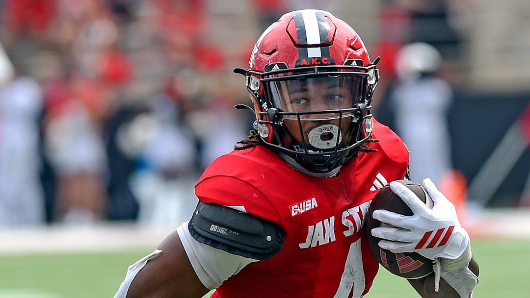 Jacksonville StateÕs Cam Cook scores a touchdown as LibertyÕs Deuce Spurlock defends during college school football action at AmFirst Stadium in Jacksonville, Alabama September 6, 2025. (Dave Hyatt / Hyatt Media LLC)