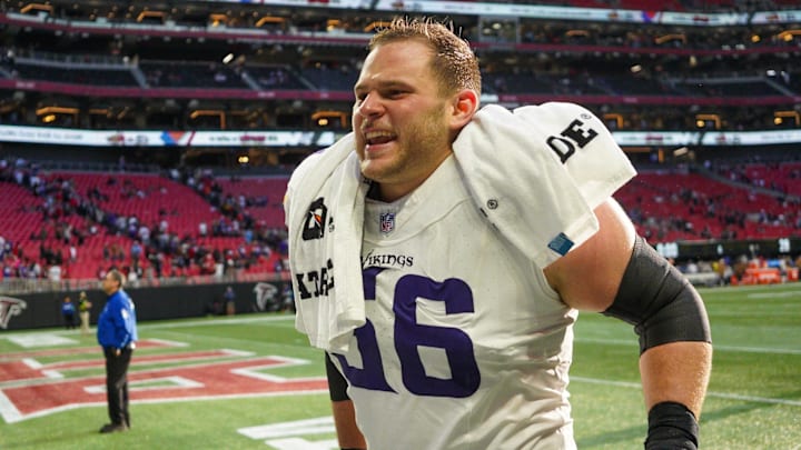 Nov 5, 2023; Atlanta, Georgia, USA; Minnesota Vikings center Garrett Bradbury (56) runs off the field after a victory against the Atlanta Falcons at Mercedes-Benz Stadium. Nov 5, 2023; Atlanta, Georgia, USA; Minnesota Vikings center Garrett Bradbury (56) runs off the field after a victory against the Atlanta Falcons at Mercedes-Benz Stadium.
