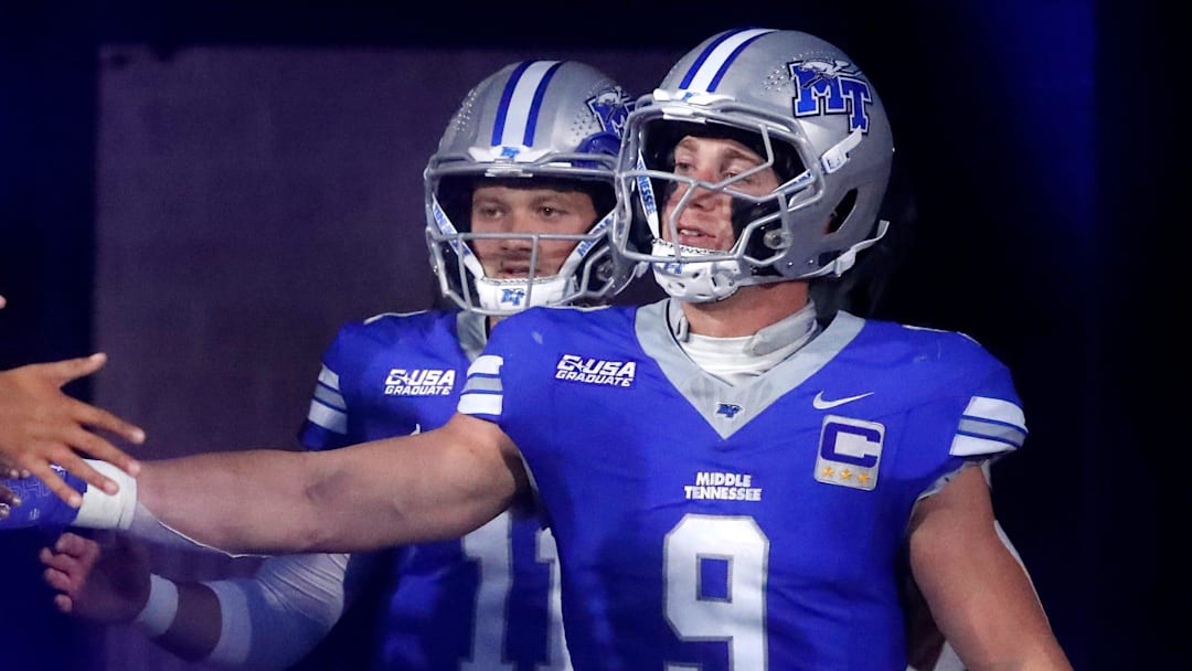 Middle Tennessee linebacker Parker Hughes (9), and Middle Tennessee quarterback Nicholas Vattiato (11) greet players as they take to the field for the coin toss before the start of the football game between Middle Tennessee and Missouri State on Wednesday, October 8, 2025, at MTSU.