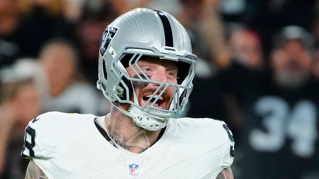 Raiders edge rusher Maxx Crosby (98) celebrates a tackle for a loss against Cardinals running back Emery Demercado (31) during a preseason game at State Farm Stadium in Glendale on Aug. 23, 2025.