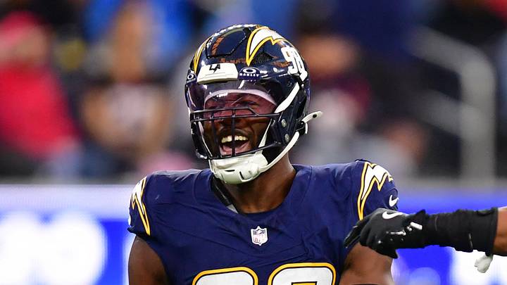 Dec 27, 2025; Inglewood, California, USA;  Los Angeles Chargers linebacker Odafe Oweh (98) and linebacker Daiyan Henley (0) react after a defensive play against the Houston Texans during the second half at SoFi Stadium. Mandatory Credit: Gary A. Vasquez-Imagn Images