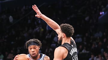 Feb 5, 2025; Brooklyn, New York, USA;  Washington Wizards forward Richaun Holmes (22) looks to post up against Brooklyn Nets guard Ben Simmons (10) in the first quarter at Barclays Center. Mandatory Credit: Wendell Cruz-Imagn Images