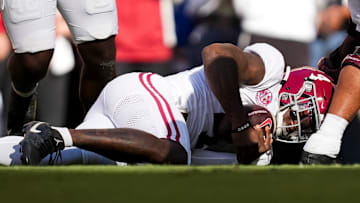 Alabama quarterback Jalen Milroe (4) dives onto a fumbled ball during an SEC conference game between Tennessee and Alabama in Neyland Stadium on Saturday, Oct. 19, 2024.