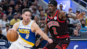 Nov 29, 2025; Indianapolis, Indiana, USA; Indiana Pacers guard T.J. McConnell (9) drives with the ball against Chicago Bulls forward Emanuel Miller (2) during the second half at Gainbridge Fieldhouse. Mandatory Credit: Trevor Ruszkowski-Imagn Images