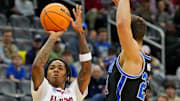 Mar 27, 2025; Newark, NJ, USA; Alabama Crimson Tide guard Labaron Philon (0) shoots the ball against Brigham Young Cougars guard Trevin Knell (21) during the first half during an East Regional semifinal of the 2025 NCAA tournament at Prudential Center.