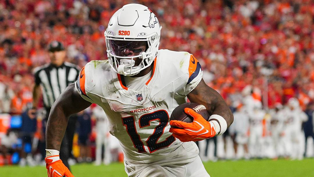 Denver Broncos running back RJ Harvey (12) runs the ball during the second half against the Kansas City Chiefs at Arrowhead Stadium. Mandatory Credit: Jay Biggerstaff-Imagn Images