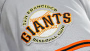 The San Francisco Giants logo on the sleeve of right fielder Michael Conforto (8) during the fifth inning against the Cincinnati Reds at Great American Ball Park. 