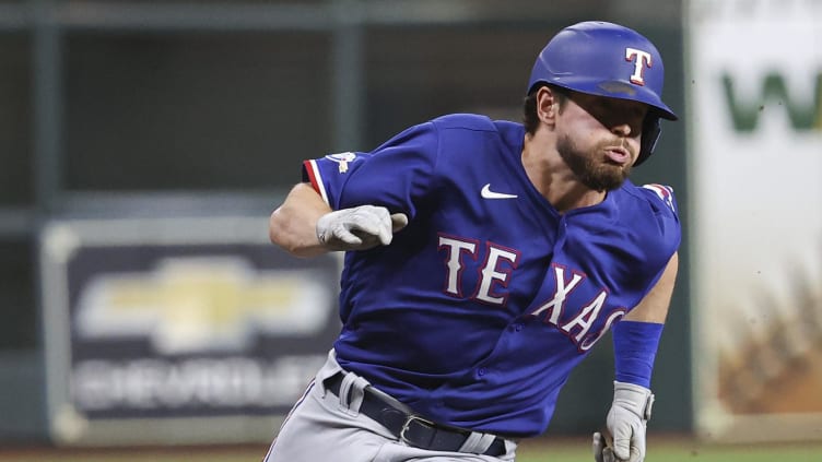 Texas Rangers designated hitter Nick Solak (15) rounds third base.