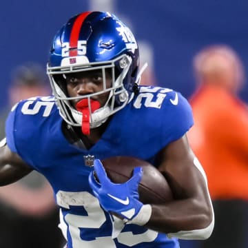 Aug 18, 2023; East Rutherford, New Jersey, USA; New York Giants running back Jashaun Corbin (25) runs after a catch against the Carolina Panthers during the fourth quarter at MetLife Stadium.  