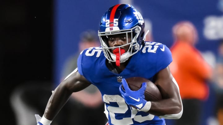 Aug 18, 2023; East Rutherford, New Jersey, USA; New York Giants running back Jashaun Corbin (25) runs after a catch against the Carolina Panthers during the fourth quarter at MetLife Stadium.  