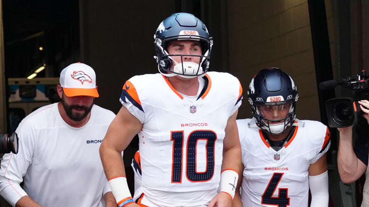 Aug 18, 2024; Denver, Colorado, USA; Denver Broncos quarterback Bo Nix (10) and quarterback Zach Wilson (4) before the preseason game against the Green Bay Packers at Empower Field at Mile High. 