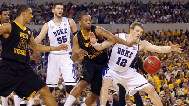 De'Sean Butler and Joe Mazzulla try to get a loose ball in a game vs. the Duke Blue Devils.