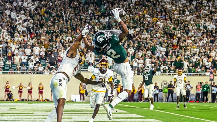 Michigan State's Tyrell Henry, right, catches a touchdown as Central Michigan's De'lavion Stepney defends during the fourth quarter on Friday, Sept. 1, 2023, at Spartan Stadium in East Lansing.