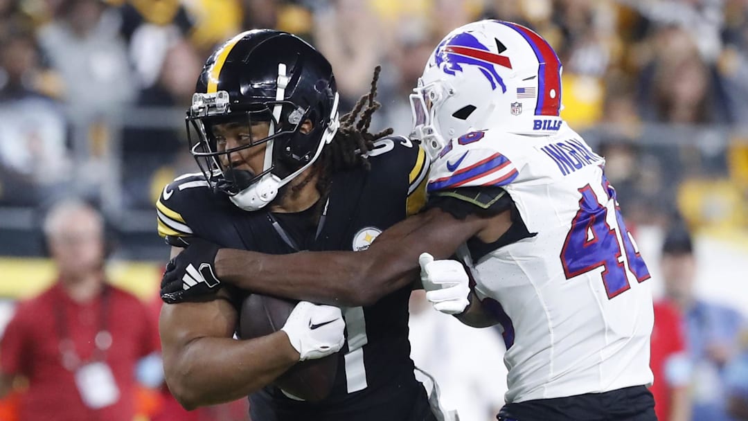 Aug 17, 2024; Pittsburgh, Pennsylvania, USA;  Pittsburgh Steelers tight end MyCole Pruitt (81) runs after a catch as Buffalo Bills cornerback Ja'Marcus Ingram (46) tackles during the third quarter at Acrisure Stadium. Buffalo won 9-3. Mandatory Credit: Charles LeClaire-Imagn Images