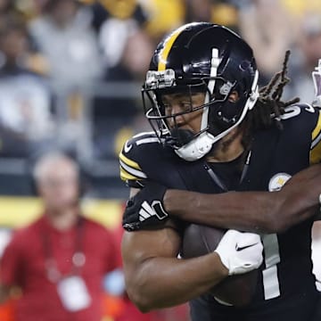 Aug 17, 2024; Pittsburgh, Pennsylvania, USA;  Pittsburgh Steelers tight end MyCole Pruitt (81) runs after a catch as Buffalo Bills cornerback Ja'Marcus Ingram (46) tackles during the third quarter at Acrisure Stadium. Buffalo won 9-3. Mandatory Credit: Charles LeClaire-Imagn Images