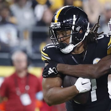 Aug 17, 2024; Pittsburgh, Pennsylvania, USA;  Pittsburgh Steelers tight end MyCole Pruitt (81) runs after a catch as Buffalo Bills cornerback Ja'Marcus Ingram (46) tackles during the third quarter at Acrisure Stadium. Buffalo won 9-3. Mandatory Credit: Charles LeClaire-Imagn Images