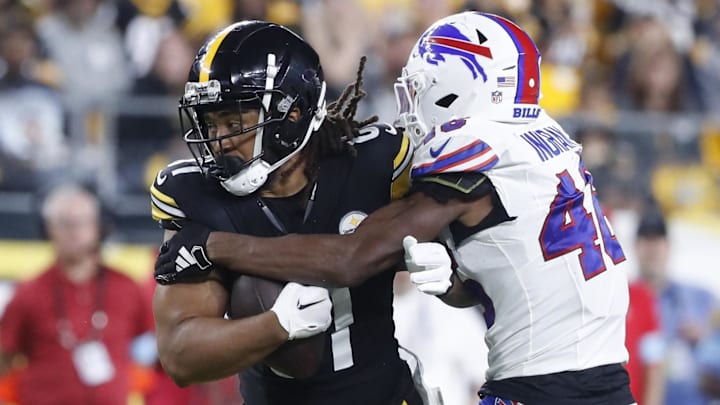 Aug 17, 2024; Pittsburgh, Pennsylvania, USA;  Pittsburgh Steelers tight end MyCole Pruitt (81) runs after a catch as Buffalo Bills cornerback Ja'Marcus Ingram (46) tackles during the third quarter at Acrisure Stadium. Buffalo won 9-3. Mandatory Credit: Charles LeClaire-Imagn Images