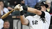 Chicago White Sox shortstop Colson Montgomery (12) hits a grand slam against the Minnesota Twins at Rate Field. 