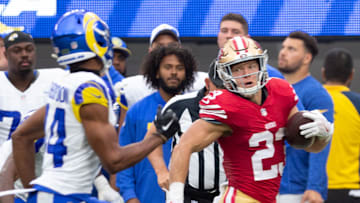 San Francisco 49ers running back Christian McCaffrey (R) and Los Angeles Rams cornerback Ahkello Witherspoon (L)