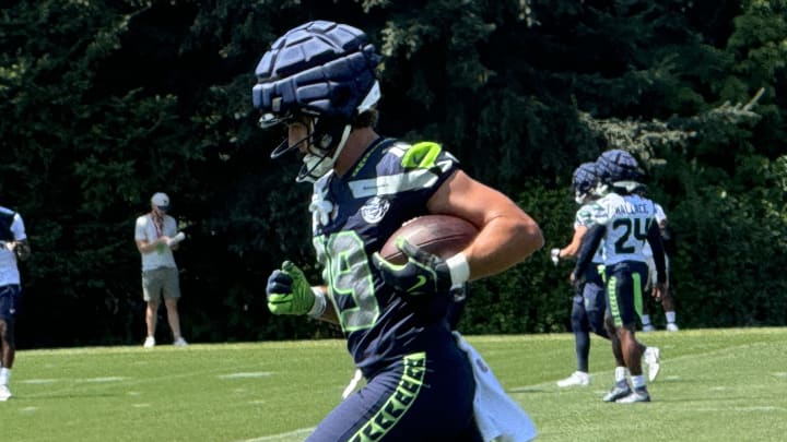 Seattle Seahawks receiver Jake Bobo runs after the catch during a passing drill at training camp.