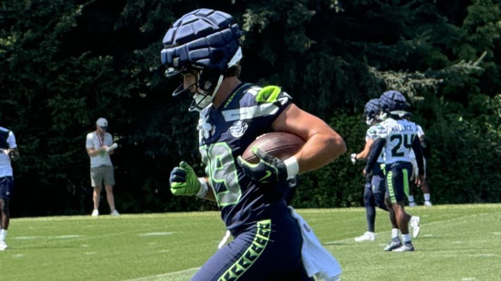 Seattle Seahawks receiver Jake Bobo runs after the catch during a passing drill at training camp.