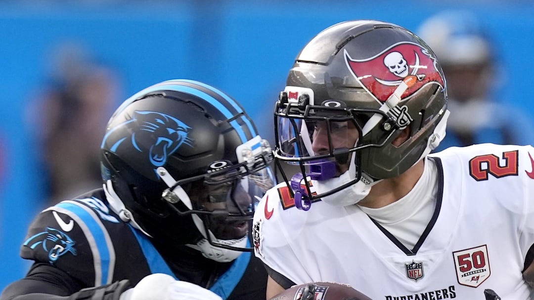 Tampa Bay Buccaneers wide receiver Emeka Egbuka runs against Carolina Panthers safety Nick Scott.