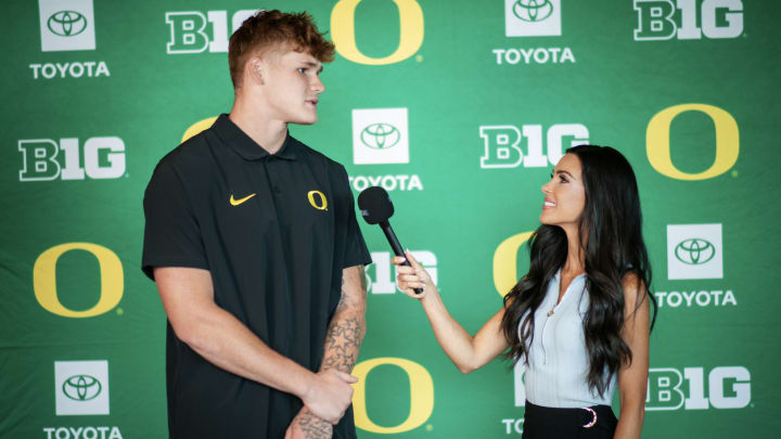 Oregon Ducks tight end Terrance Ferguson talks to Sports Illustrated reporter Bri Amaranthus at Oregon media day in Eugene, Oregon. The Ducks begin their fall camp practices. 