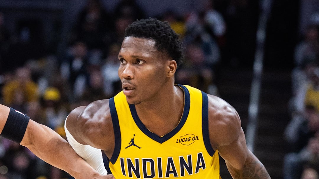 Jan 2, 2026; Indianapolis, Indiana, USA;  Indiana Pacers guard/forward Bennedict Mathurin (00) dribbles the ball while  San Antonio Spurs forward Carter Bryant (11) defends in the first half at Gainbridge Fieldhouse. Mandatory Credit: Trevor Ruszkowski-Imagn Images