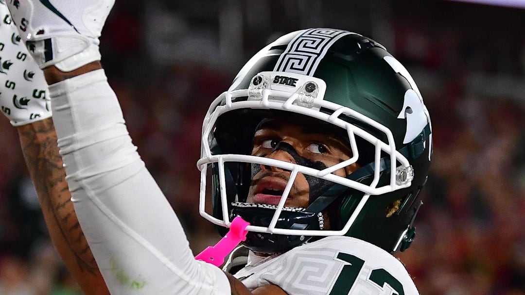 Sep 20, 2025; Los Angeles, California, USA; Michigan State Spartans wide receiver Chrishon McCray (13) celebrates his touchdown scored against the Southern California Trojans during the first half at the Los Angeles Memorial Coliseum. Mandatory Credit: Gary A. Vasquez-Imagn Images