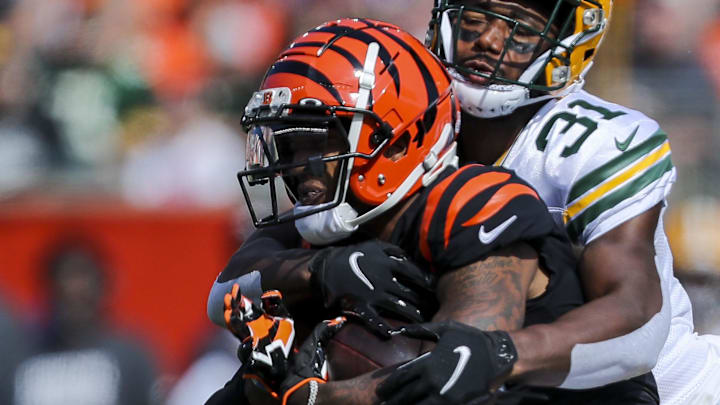 Cincinnati Bengals wide receiver Ja'Marr Chase (1) runs with the ball against the Green Bay Packers in 2021.