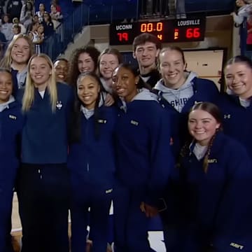 Paige Bueckers posed for a picture with her former teammates after their season-opening victory over Louisville. 