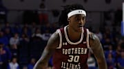 Nov 22, 2024; Gainesville, Florida, USA; Southern Illinois Salukis guard Kennard Davis Jr. (30) drives to the basket against the Florida Gators during the first half at Exactech Arena at the Stephen C. O'Connell Center. Mandatory Credit: Matt Pendleton-Imagn Images