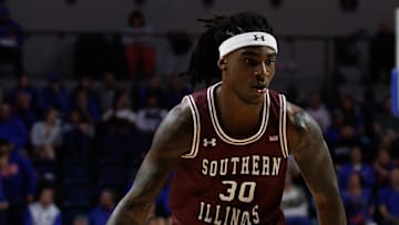 Nov 22, 2024; Gainesville, Florida, USA; Southern Illinois Salukis guard Kennard Davis Jr. (30) drives to the basket against the Florida Gators during the first half at Exactech Arena at the Stephen C. O'Connell Center. Mandatory Credit: Matt Pendleton-Imagn Images