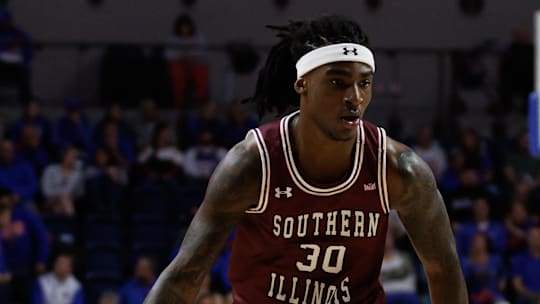Nov 22, 2024; Gainesville, Florida, USA; Southern Illinois Salukis guard Kennard Davis Jr. (30) drives to the basket against the Florida Gators during the first half at Exactech Arena at the Stephen C. O'Connell Center. Mandatory Credit: Matt Pendleton-Imagn Images