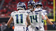 Dec 7, 2025; Atlanta, Georgia, USA; Seattle Seahawks wide receiver Jaxon Smith-Njigba (11) and quarterback Sam Darnold (14) celebrate after a touchdown against the Atlanta Falcons in the fourth quarter at Mercedes-Benz Stadium. 