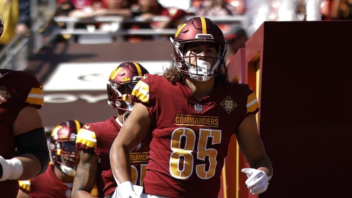 Oct 9, 2022; Landover, Maryland, USA; Washington Commanders center Tyler Larsen (69) and Commanders tight end Cole Turner (85) run out of the tunnel onto the field prior to their game against the Tennessee Titans at FedExField. Mandatory Credit: Geoff Burke-USA TODAY Sports