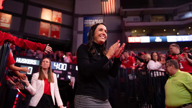 Nebraska women's basketball coach Amy Williams enters Pinnacle Bank Arena for a game against Creighton.