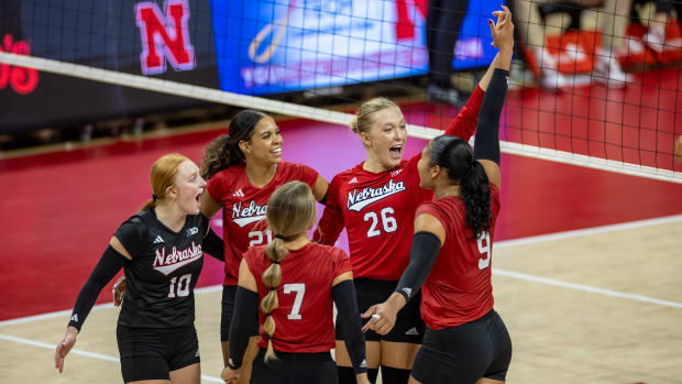 Nebraska volleyball's Red team, including alum Lauren Stivrins (26) celebrate a point during the annual Red-White Scrimmage.