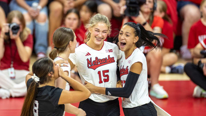 Nebraska volleyball players (l-r) Lexi Rodriguez, Bergen Reilly, Andi Jackson, and Harper Murray celebrate a point during the annual Red-White Scrimmage.