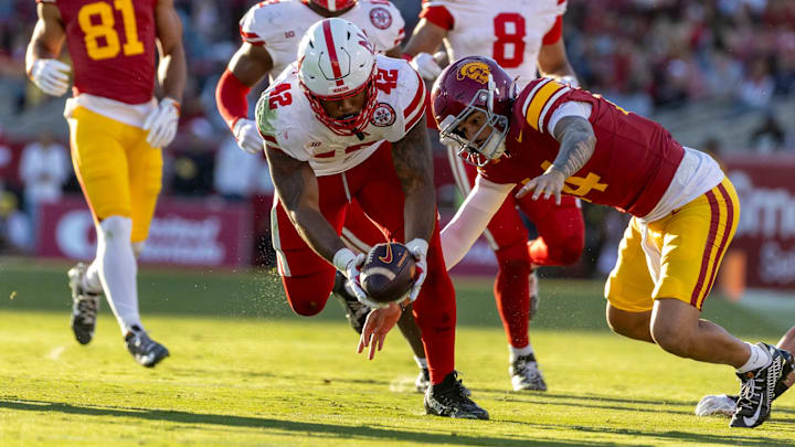 Mikai Gbayor recovers a fumble during Nebraska's 2024 game at USC. Mikai Gbayor recovers a fumble during Nebraska's 2024 game at USC.