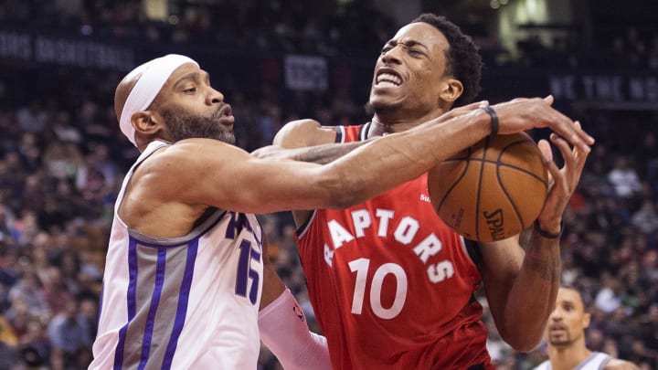 Dec 17, 2017; Toronto, Ontario, CAN; Toronto Raptors guard DeMar DeRozan (10) drives to the basket as Sacramento Kings guard Vince Carter (15) defends in the third quarter at Air Canada Centre. Mandatory Credit: Nick Turchiaro-USA TODAY Sports